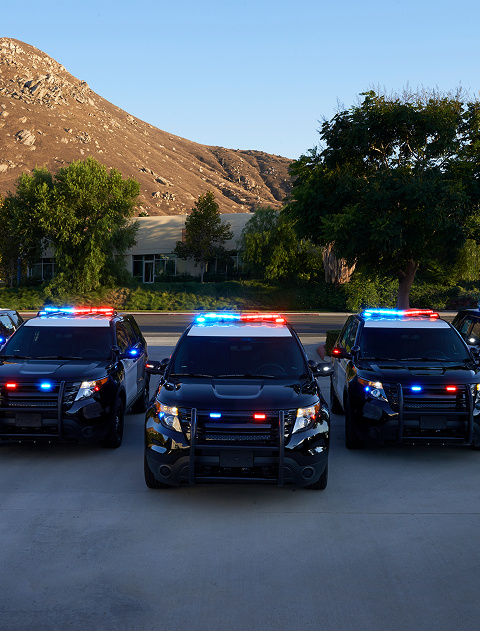 Three police cars with lights on