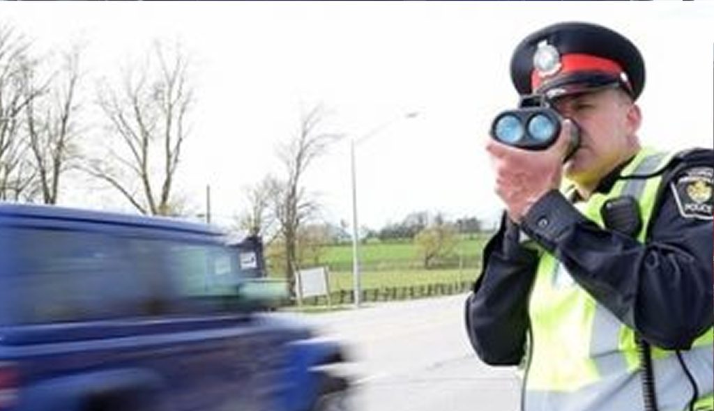 Police man documenting traffic